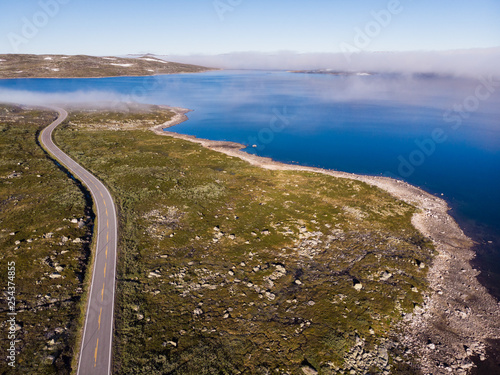 Road crossing Hardangervidda plateau, Norway. Aerial view. photo