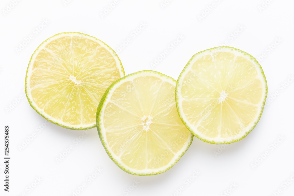 Composition with fresh ripe limes on light background, top view Composition with fresh ripe limes on light background, top view
