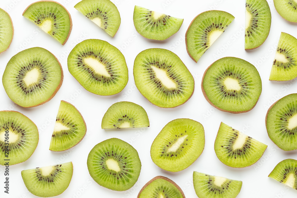 Fototapeta premium Kiwi fruit slices on white background.