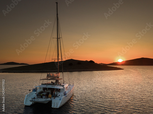 Sunset on a catamaran © Maxime