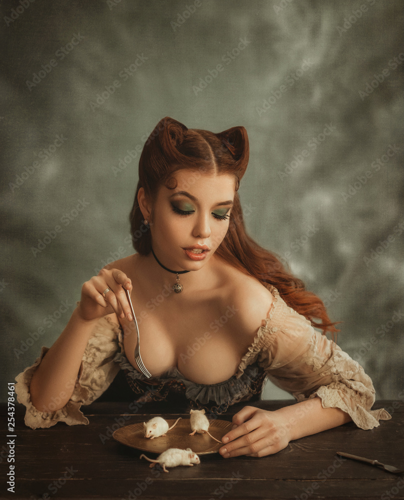 Fantasy woman cat. redhead lady with cat ears made of hair eats white mouse  from golden