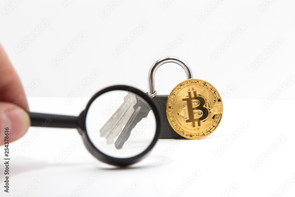 The key to the bitcoin lock is considered a magnifying glass. Concept selection hacking bitcoin. The key to the bitcoin lock is considered a magnifying glass. Concept selection hacking bitcoin.