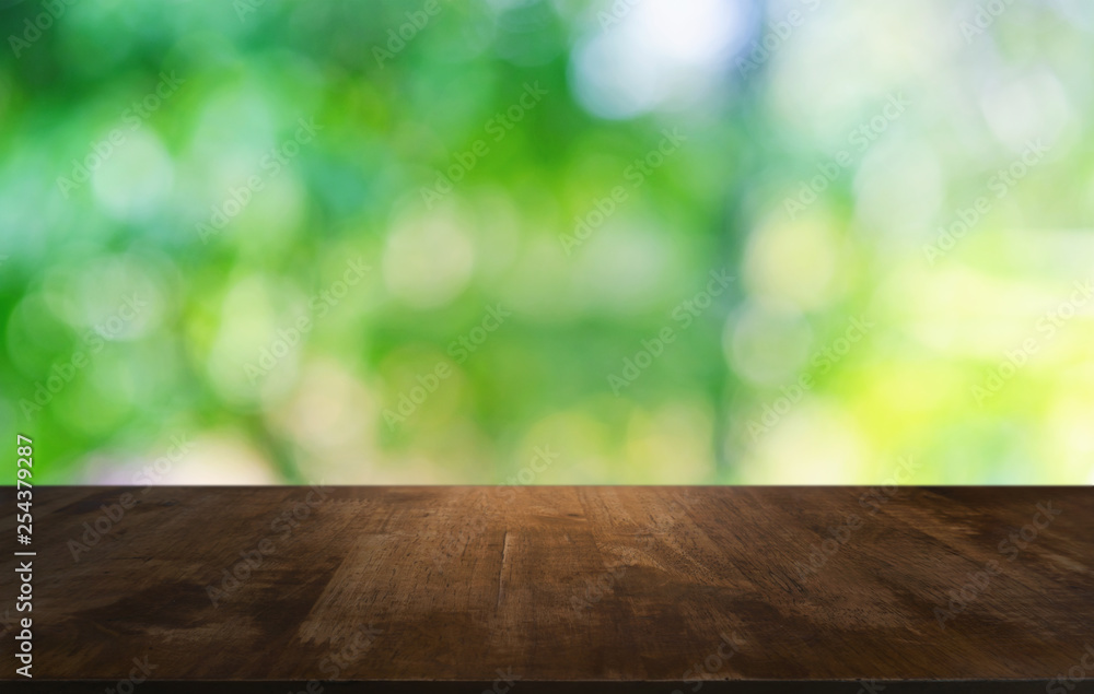 Empty dark wooden table in front of abstract blurred bokeh background of restaurant . can be used for display or montage your products.Mock up for space. Empty dark wooden table in front of abstract blurred bokeh background of restaurant . can be used for display or montage your products.Mock up for space.