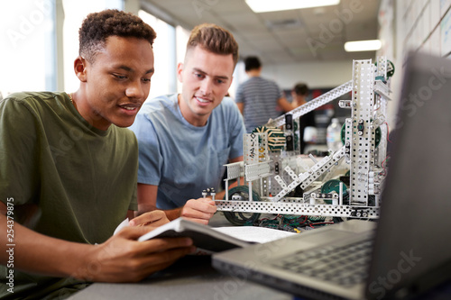 Photos Two Male University Students Building Machine In Science Robotics Or Engineering