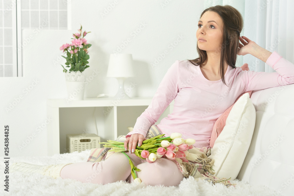Beautiful young woman with bouquet of flowers Beautiful young woman with bouquet of flowers