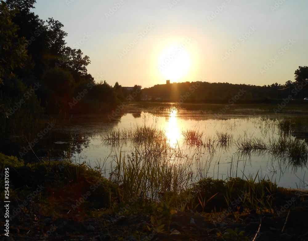 Sunset over the lake in summer. Sunset over the lake in summer.