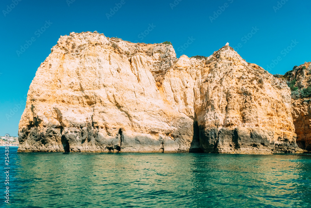 Ocean Landscape With Rocks And Cliffs At Lagos Bay Coast In Algarve, Portugal