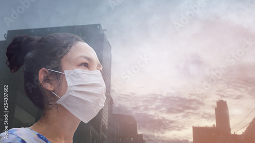 women wearing facial hygienic mask for Safety outdoor. People in masks because of fine dust in thailand. Problems found in major cities around the world. air pollution,Environmental awareness concept #254387682