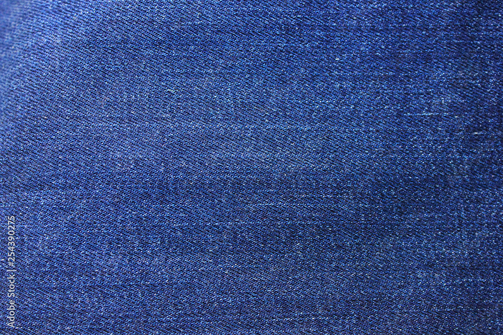 Denim blue jeans texture background of empty dark jean fabric. Close up top  view banner and