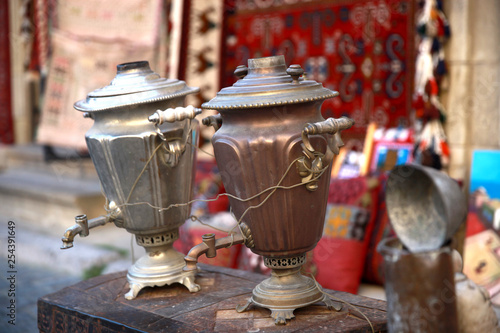 Russian traditional tea-drinking samovar. Ornate silver samovar on the street. photo