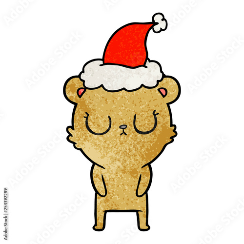 peaceful textured cartoon of a bear wearing santa hat © lineartestpilot