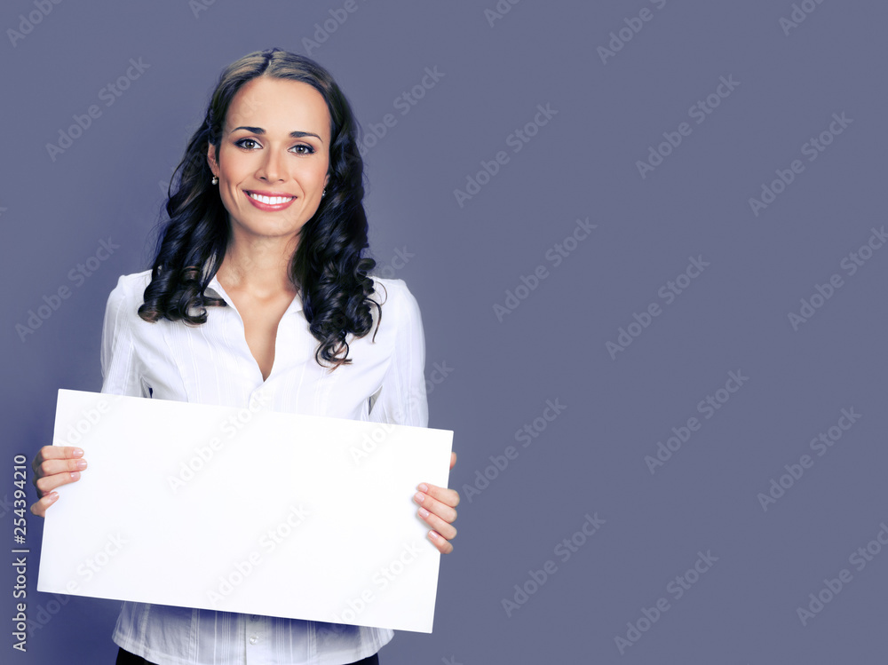 Young businesswoman showing blank signboard Young businesswoman showing blank signboard