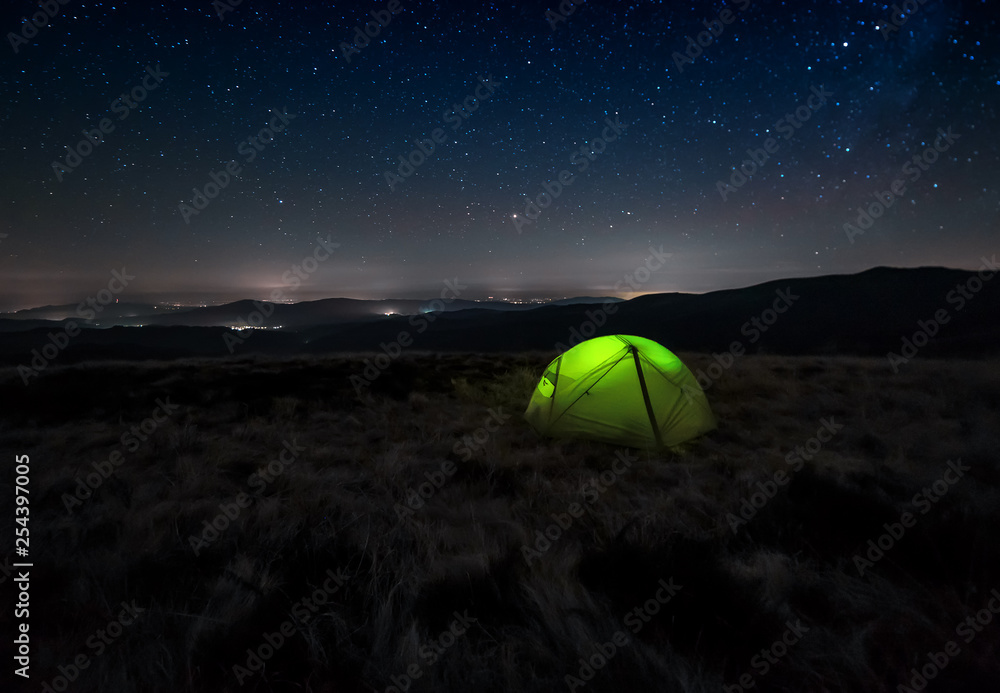 green tent on night landscape