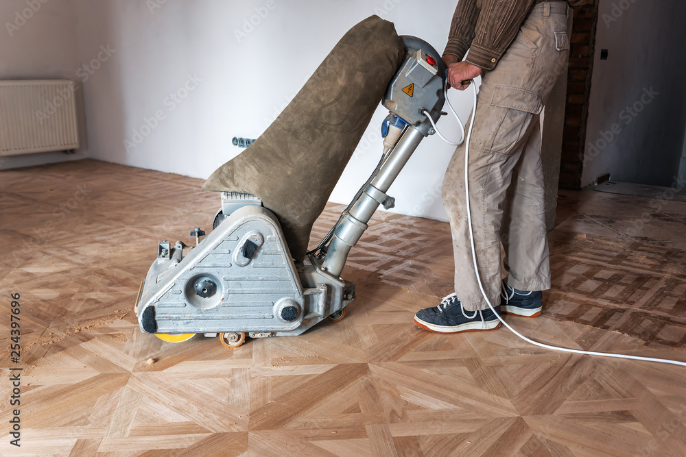 professional master grinding a parquet - obrazy, fototapety, plakaty 