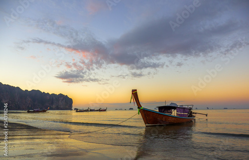 Traditionnal Long tail boat at sunset