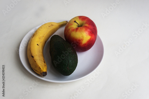 Fruits in a white plate. Candid. photo