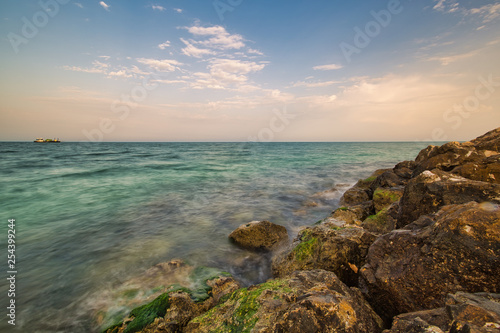 Rocks with green moss in Wakra port Qatar