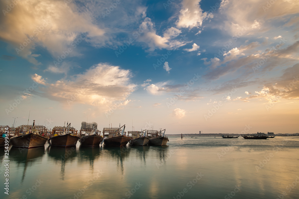 Tradional dhows in a calm water in Wakra port QatarTradional dhows in a calm water in Wakra port Qatar