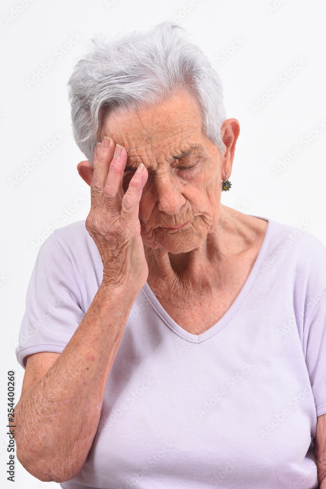 senior woman with headache on white background senior woman with headache on white background