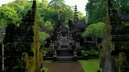 Buddhist Pura Gunung Lebah temple in Ubud tropical forest. Aerial drone 4k footage. photo