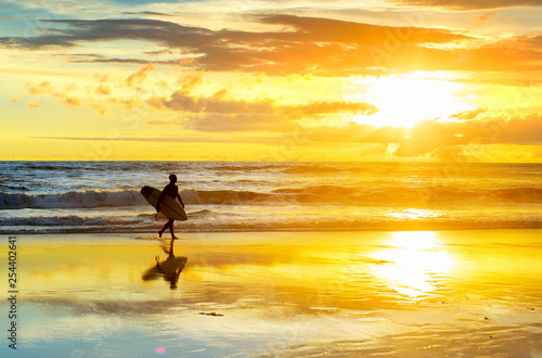 surfer beach reflection susnet Bali