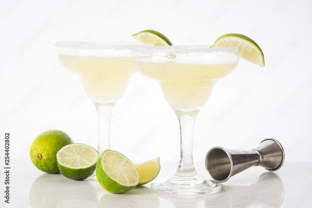 Margarita cocktails with lime in glass isolated on white background. 