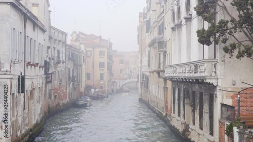 Venice canal in morning mist/fog.