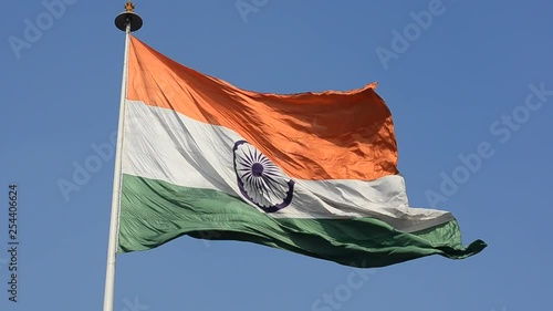 Indian National Flag, the tricolor fluttering and unfurling in the Central Park at Connaught Place. It is the largest Indian flag on public display in Delhi, India photo
