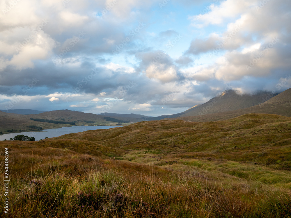 meadow landscape with a lake and mountains meadow landscape with a lake and mountains