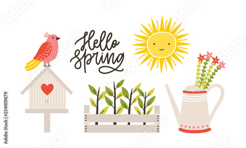 Decorative postcard template with Hello Spring phrase handwritten with cursive font, seedlings in crate, watering can full of flowers, bird sitting on nesting box and sun