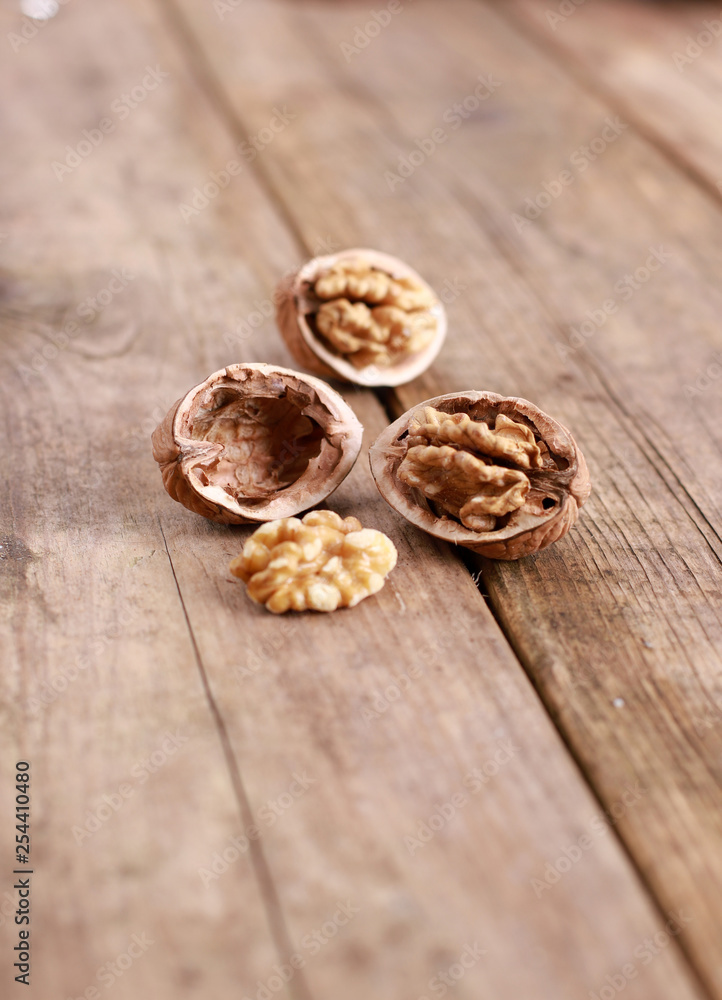 walnuts on a rustic wooden table - close up