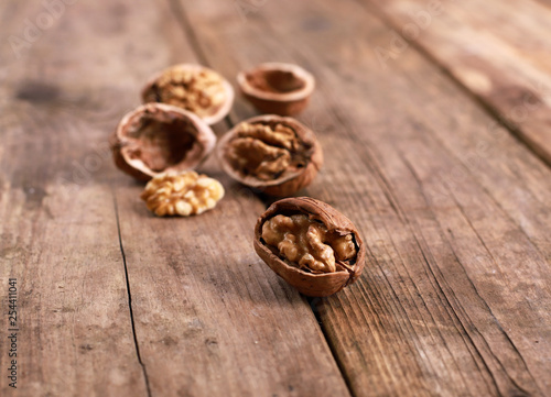 walnuts on a rustic wooden table - close up