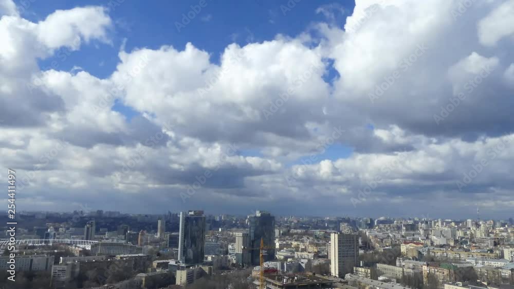 Clouds shed over the city. Time Lapse. Clouds rush over residential buildings in the city. Clouds shed over the city. Time Lapse. Clouds rush over residential buildings in the city.