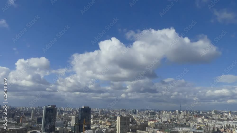 Clouds shed over the city. Time Lapse. Clouds rush over residential buildings in the city. Clouds shed over the city. Time Lapse. Clouds rush over residential buildings in the city.