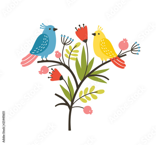 Seasonal composition with pair of lovely cute birds sitting on branch with blooming spring flowers and leaves