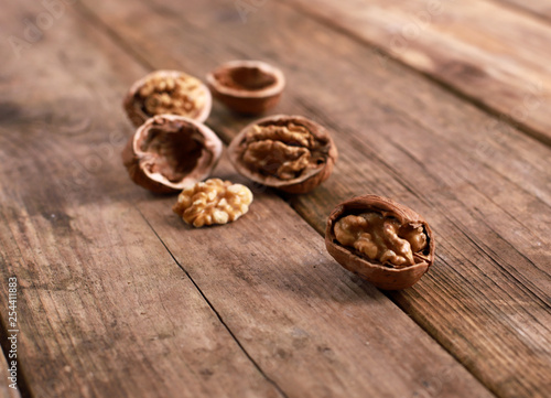 walnuts on a rustic wooden table - close up