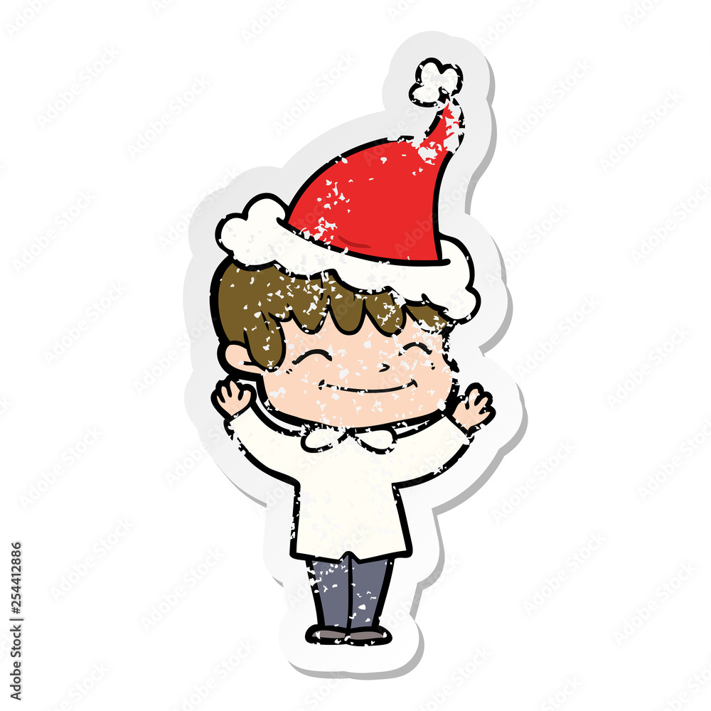 distressed sticker cartoon of a happy boy wearing santa hat