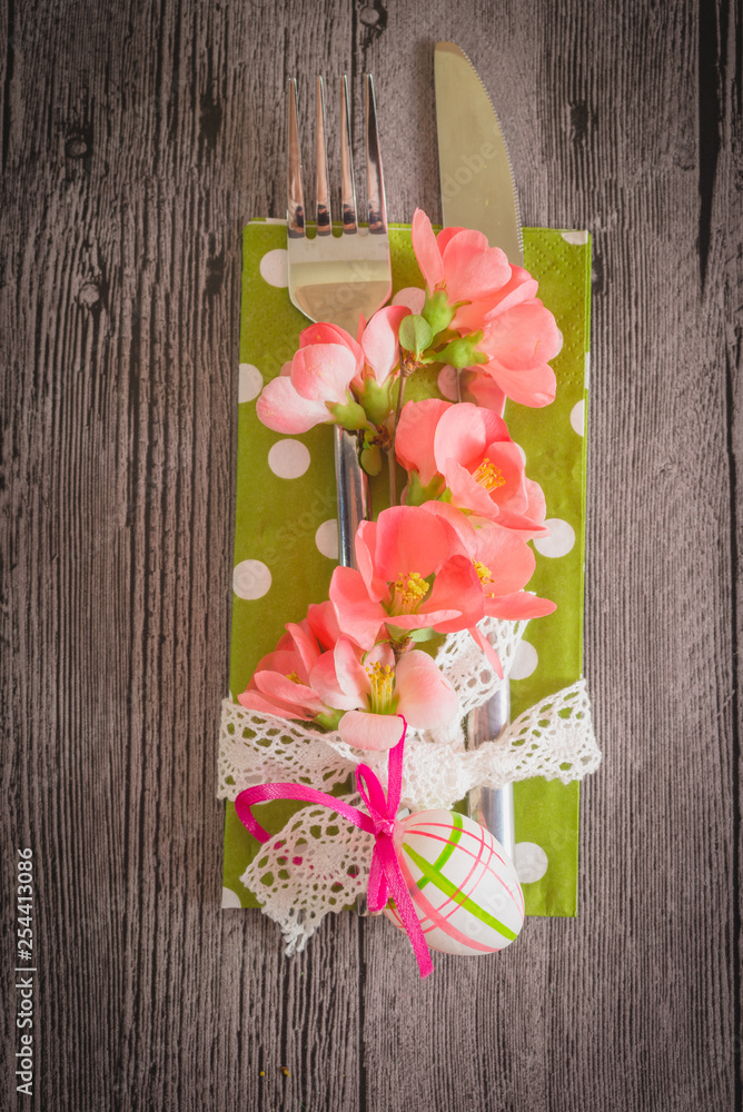 Easter table setting with daffodil and cutlery. Holidays background Easter table setting with daffodil and cutlery. Holidays background