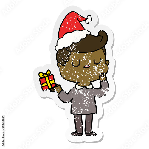 distressed sticker cartoon of a man wondering wearing santa hat