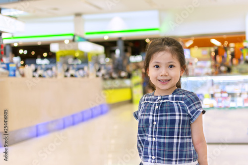 Cute Little Asian Girl in Shopping Center.
