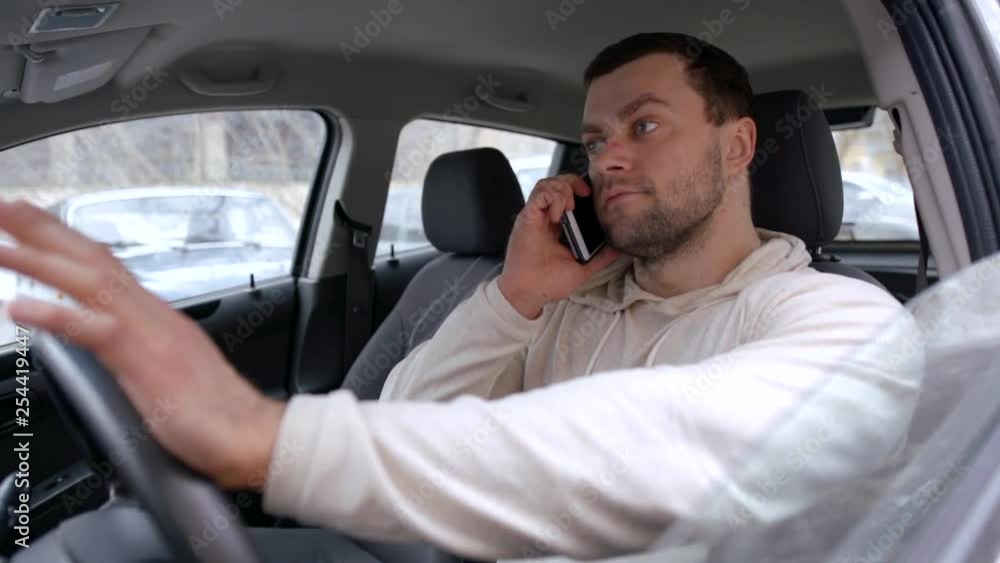 Tired and angry driver talking on the phone. Tired and angry driver talking on the phone.