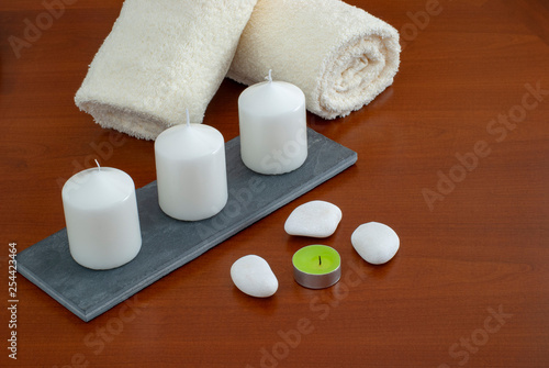 towels candles stones and orchid