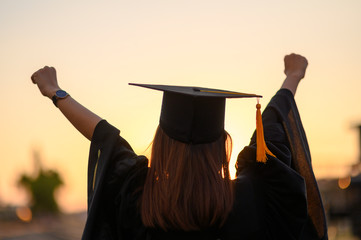 Graduates wear a black dress, black hat at the university level.