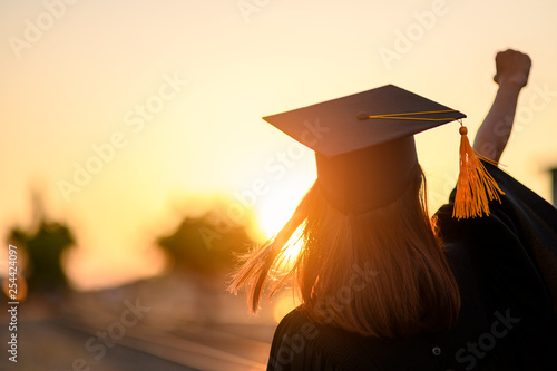 Graduates wear a black dress, black hat at the university level.