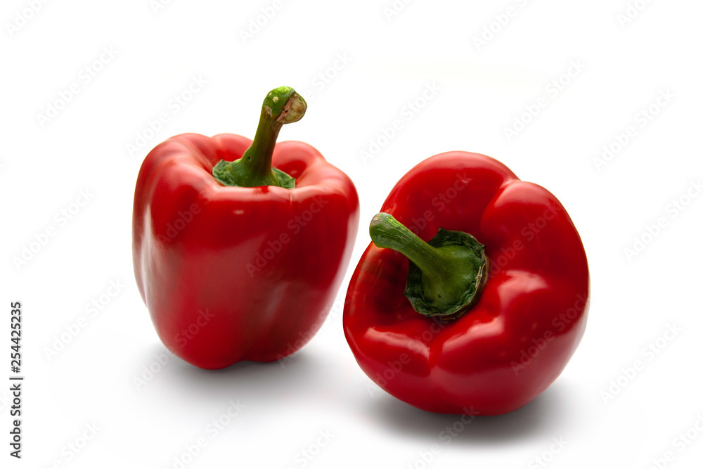 Two red pepper on a white background