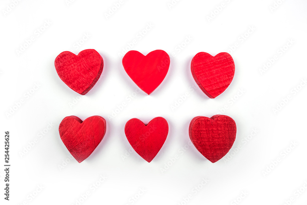 Small red wooden hearts isolated on the white background.