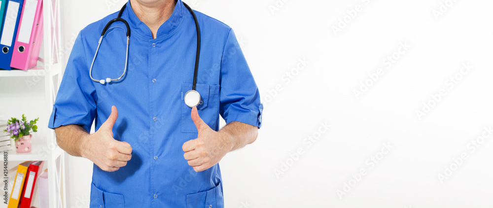close up of male doctor hand showing thumbs up - cropped image. Medical insurance, copy space. close up of male doctor hand showing thumbs up - cropped image. Medical insurance, copy space.
