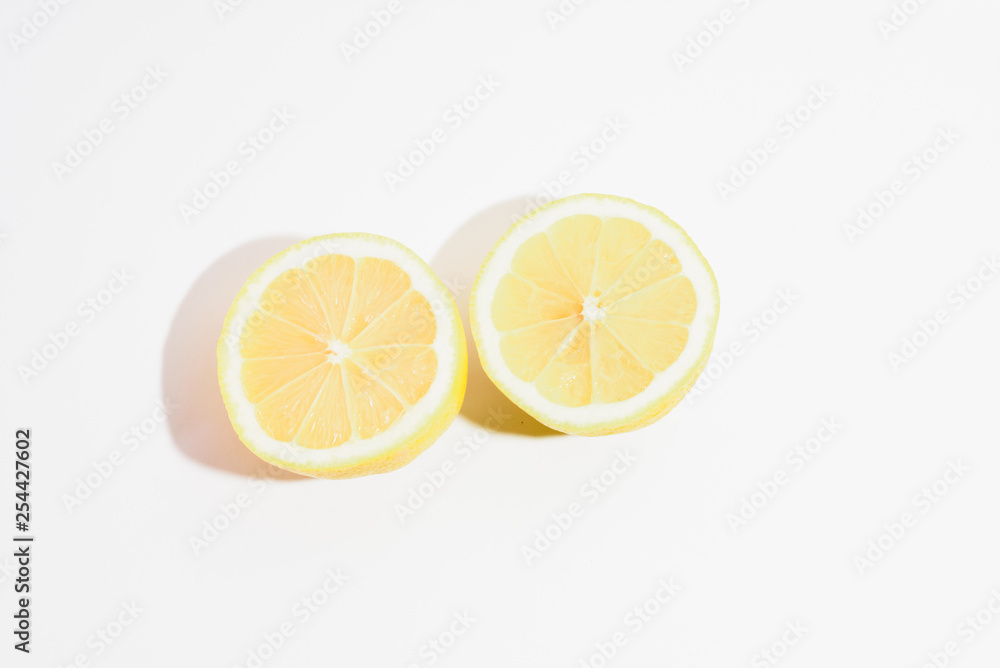 two half lemons on white background