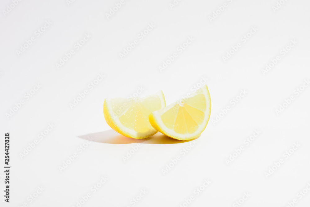 two lemon slices on a white background two lemon slices on a white background