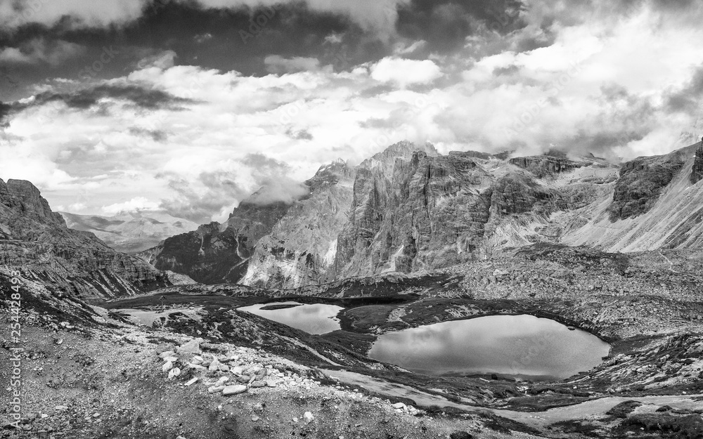Three Peaks of Lavaredo in summer season with lake, Italian Alps